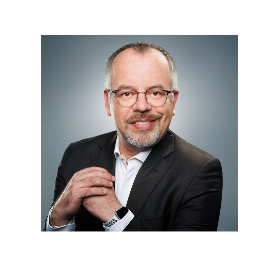 Profile Picture of Adrián Moreno (@zetxek), working side by side with a colleague: sitting on a desk, while looking at a screen